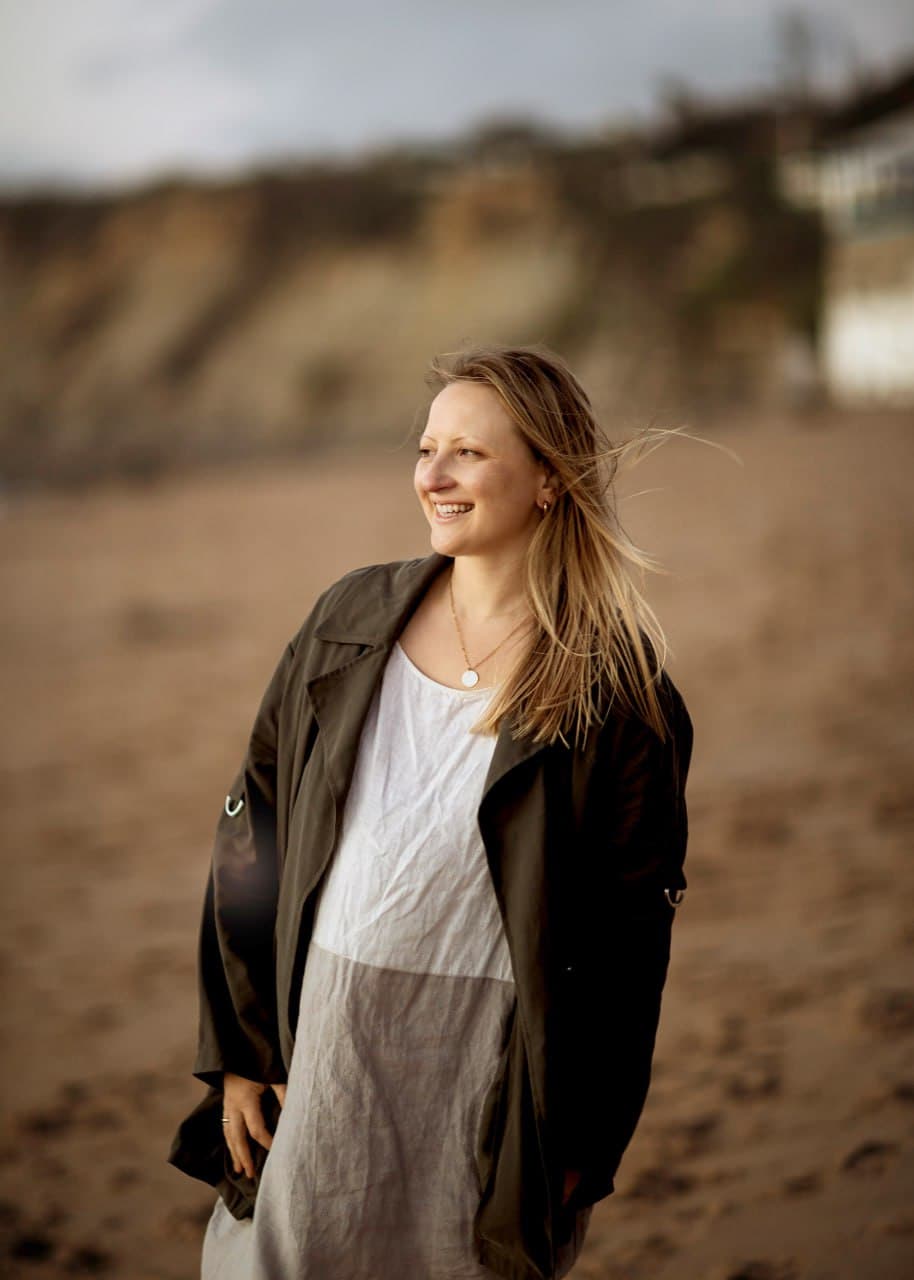 Vaida Baio, leadership coach, on the beach in Ericeira, Portugal